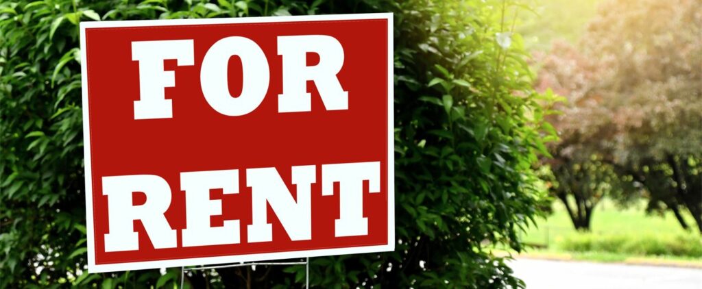 landscape_for-rent-sign-in-a-yard-with-grass-and-bushes-hou-2021-09-03-10-05-05-utc